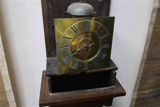 An early 19th century oak cased wall timepiece with alarum, height 31in.